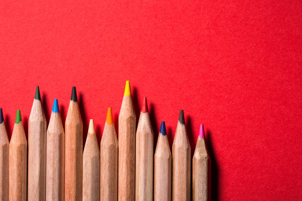 istock line of colored pencils on bright red background 688754610