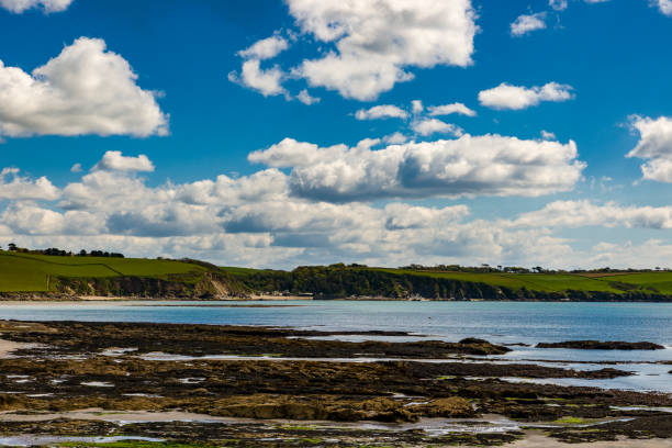 istock View from Spit Beach to Polkerris Harbour at very low tide during the New Moon Phase. 688754908