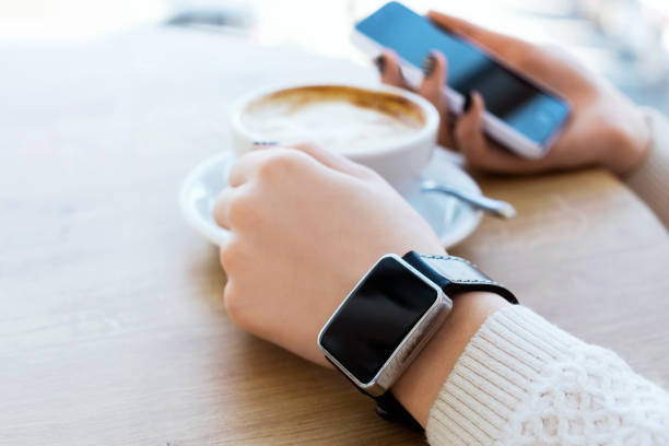 istock Cup of coffee, watch and mobile phone 688765288