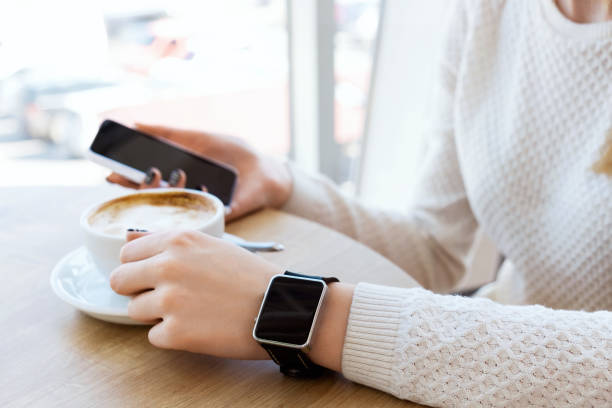 istock Cup of coffee, watch and mobile phone 688770276