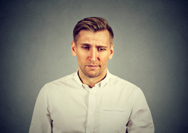 istock portrait of a sad man 688774402