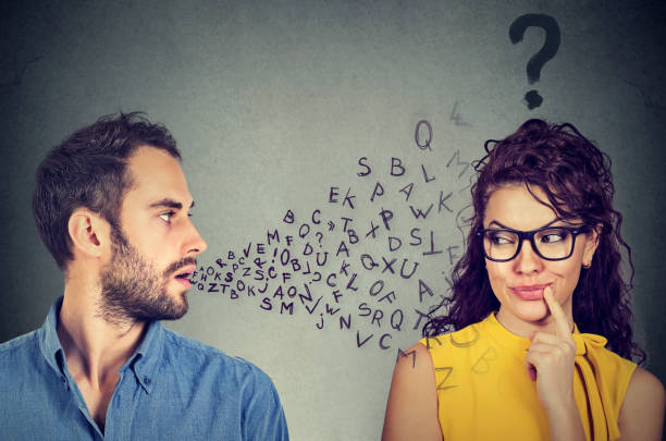 istock Language barrier concept. Man talking to a young woman with question mark 688776842