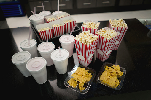 Close-up on food and drinks at the movies - entertainment concepts