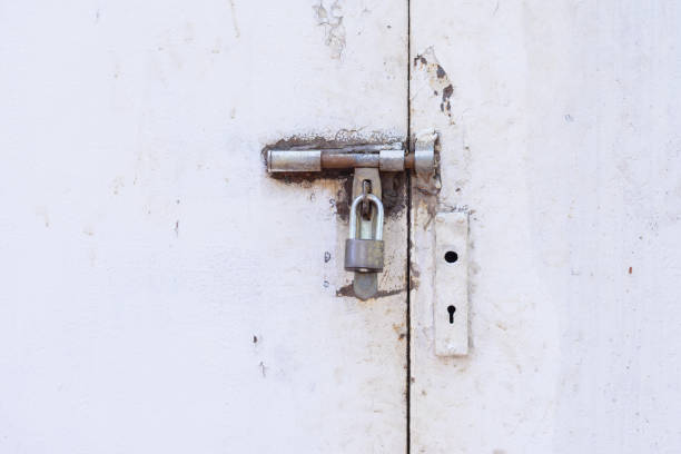 istock Locked door, grunge metal with rust doors. 688784322