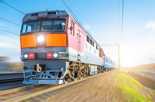 istock Passenger diesel train traveling speed railway wagons journey sunset light. 688796140