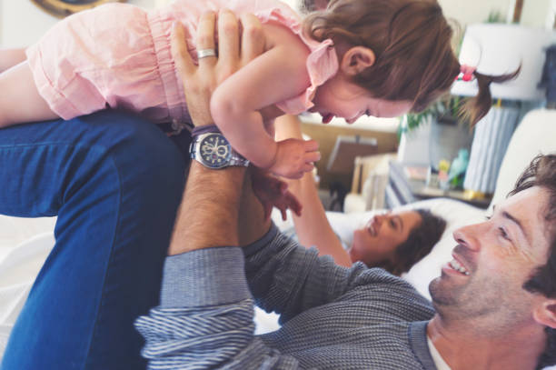 istock Family playing on the bed. 688796726