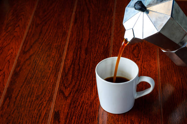 istock coffee flow from moka pot to a cup 688796732