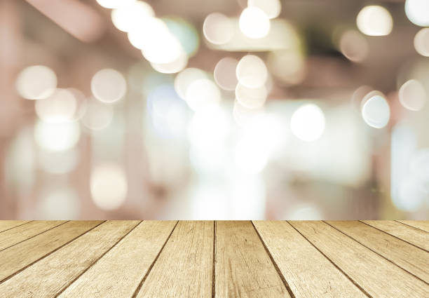 istock Perspective wood and blurred store with bokeh background, product display montage 688811834