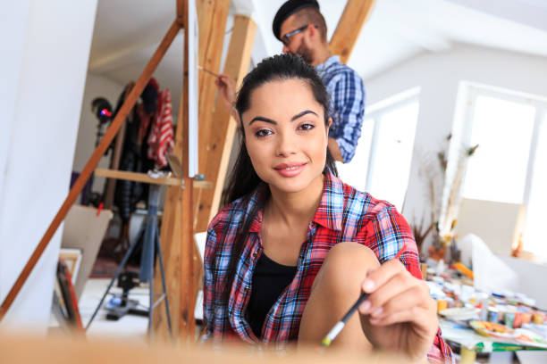 istock Fine art painters drawing in atelier together 688819120