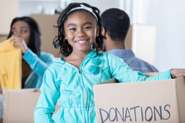 istock Confident African American girl holds donation box 688821438