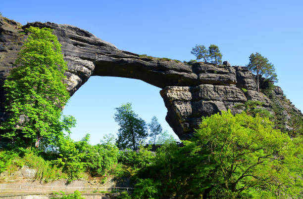 View of Pravcicka brana in National Park Czech Switzerland. View of Pravcicka brana, largest natural sandstone arch in Europe in National Park Czech Switzerland. pravcicka stock pictures, royalty-free photos & images