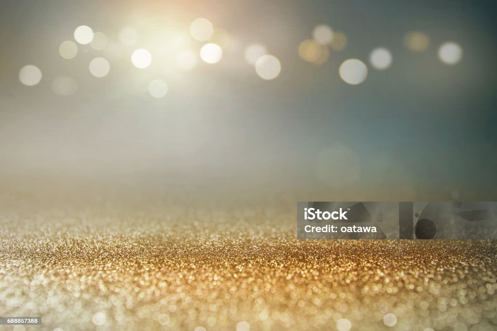 Vintage glitter gold, dark blue and black lights bokeh background. Vintage glitter gold, dark blue and black lights bokeh background. defocused. Backgrounds Stock Photo