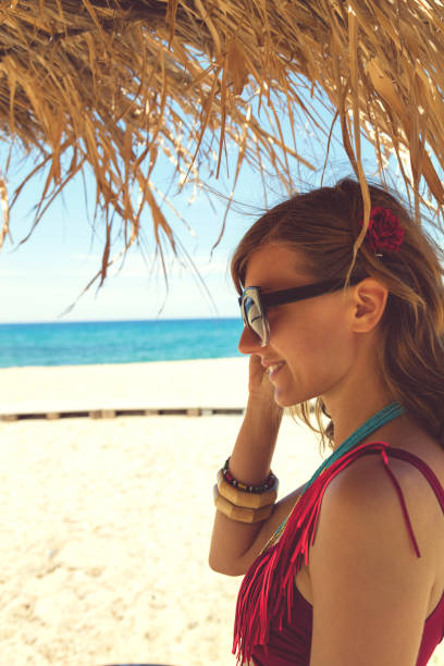 istock Attractive cute woman enjoying on the beach. 688857506