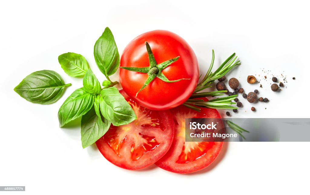 composition of fresh vegetables and spices fresh tomato, herbs and spices isolated on white background, top view Tomato Stock Photo