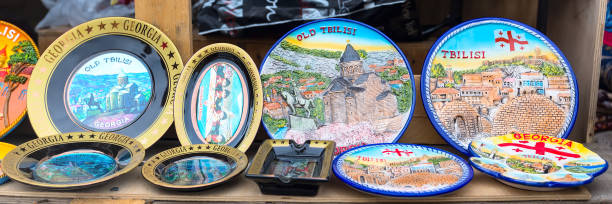 Georgian gift souvenir plates in the shop Mtskheta, Georgia - April 28, 2017: Georgian gift souvenir plates in the shop historic heritage square phoenix stock pictures, royalty-free photos & images