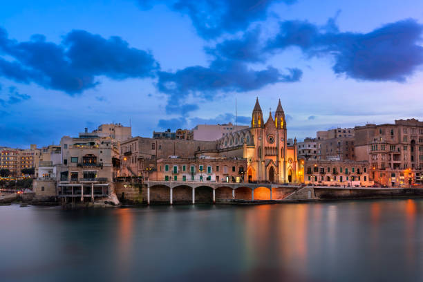 Balluta Bay and Church of Our Lady of Mount Carmel in the Evening, Saint Julian, Malta Balluta Bay and Church of Our Lady of Mount Carmel in the Evening, Saint Julian, Malta st julians bay stock pictures, royalty-free photos & images