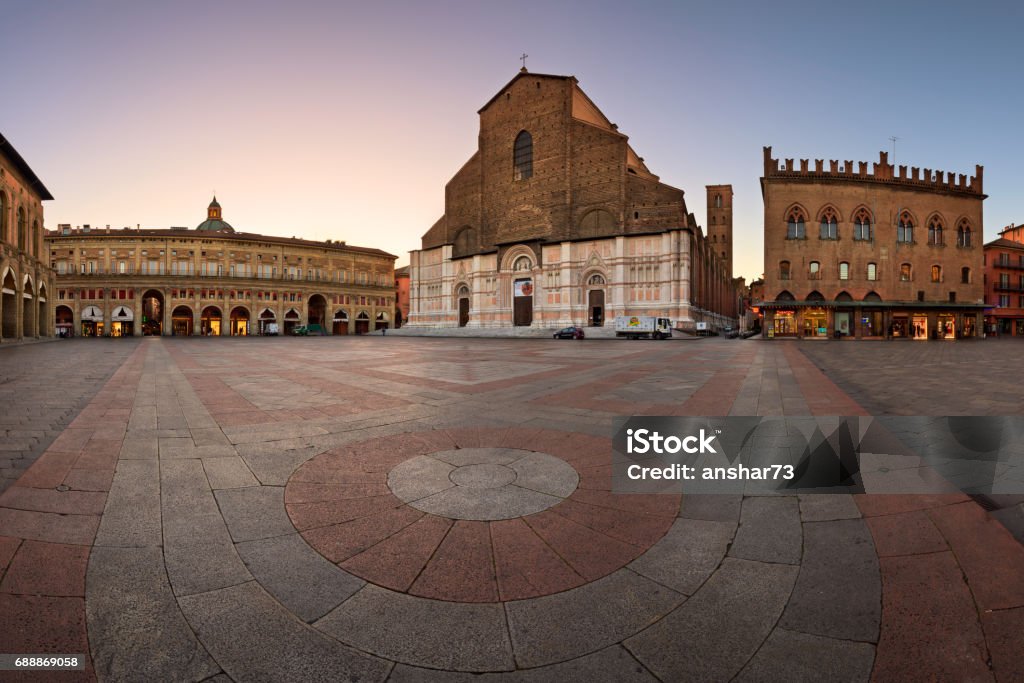 Piazza Maggiore and San Petronio Basilica in the Morning, Bologna, Emilia-Romanga, Italy BOLOGNA, ITALY - JANUARY 29, 2016: San Petronio Basilica in Bologna, Italy. With its volume of 258,000 m3, it is the largest church built in bricks of the world. Bologna Stock Photo