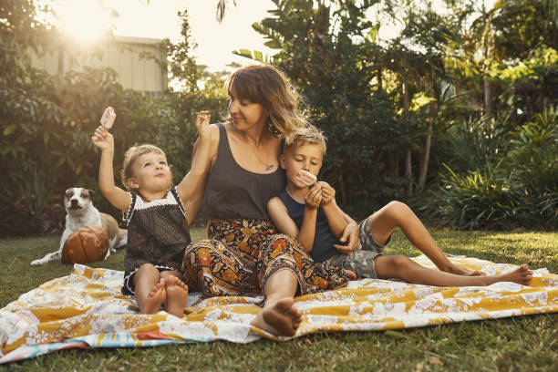 she loves her ice cream - family with two children imagens e fotografias de stock