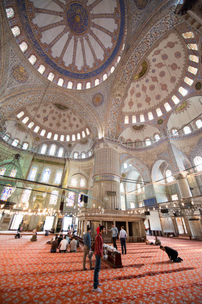 Interior of the Blue Mosque,  Sultanahmet Mosque Istanbul, Turkey. Istanbul-Turkey - September, 11, 2016: People who visited and praying inside the Blue Mosque. turkey koran people design stock pictures, royalty-free photos & images