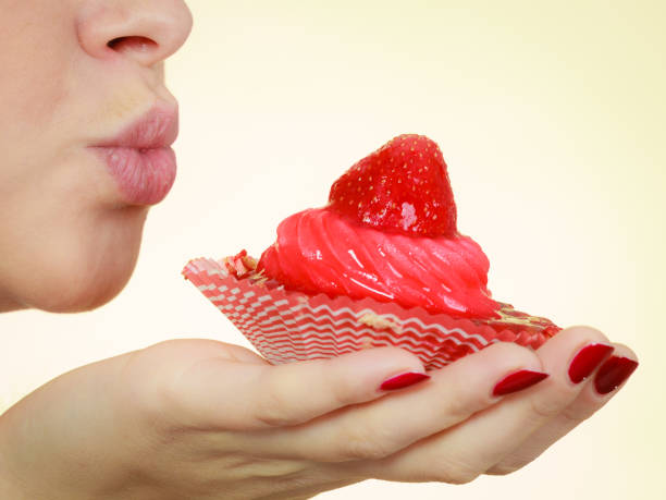 istock Woman holding sweet delicious cupcake 688874676