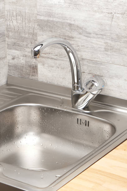istock Kitchen sink in drops of water 688879276