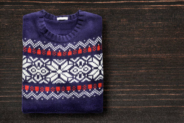 istock Sweater on wooden background 688879440