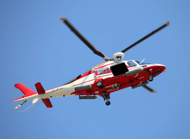 istock Relief Helicopter flies fast in the blue sky during the emergenc 688889422