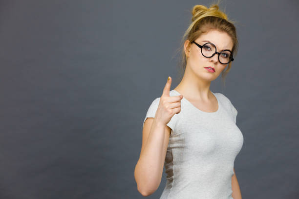 istock Woman wearing eyeglasses pointing at camera 688892192