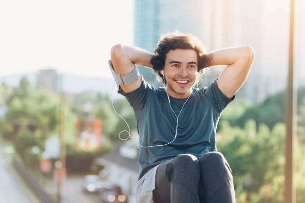 istock Athlete making sit-ups outdoors 688892416