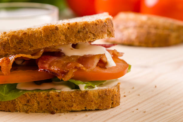 istock bacon sandwich on wooden table 688896668