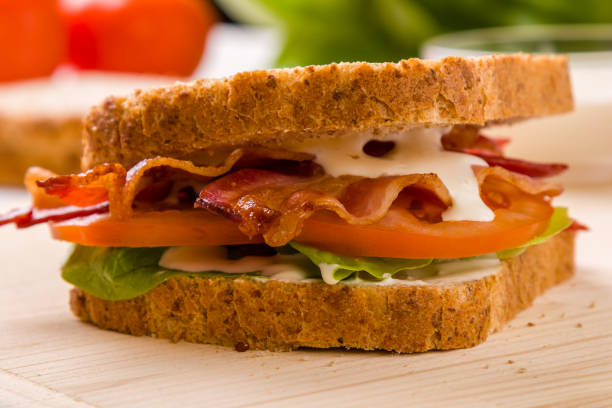 istock bacon sandwich on wooden table 688896670