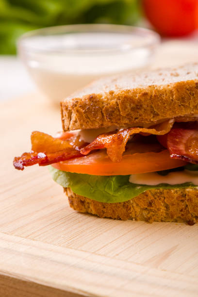 istock bacon sandwich on wooden table 688900560