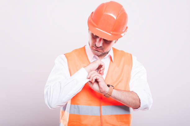 istock Foreman wearing reflective vest arranging shirt button 688904446