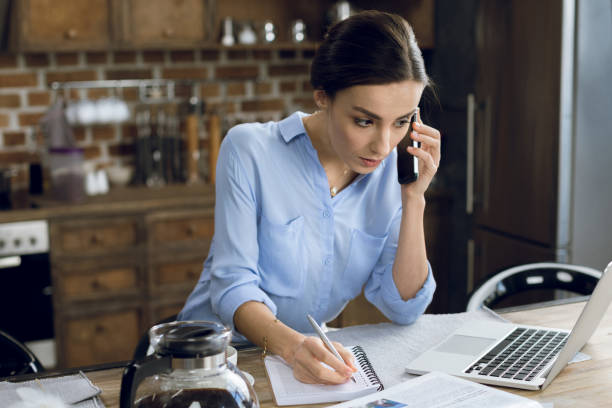 istock Woman using laptop and smartphone 688906888