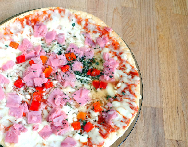 istock Part of cooked pizza with bacon and cheese and vegetables closeup 688908160