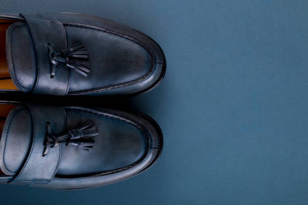 istock Blue loafer shoes on blue background. One pair. Top view. Copy space. 688911308