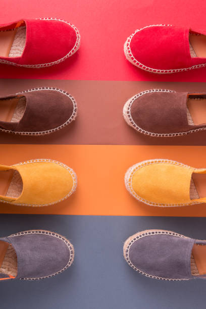 istock Espadrilles on multicolor background. Top view. Four pairs. 688911328