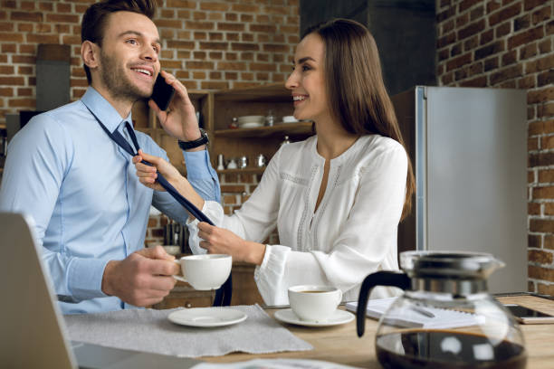 istock businesswoman tying tie 688911522