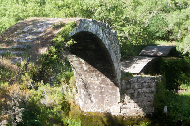 istock Middle ages bridge in Galicia, Spain 688914646