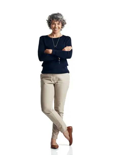 Studio portrait of a confident mature woman posing against a white background