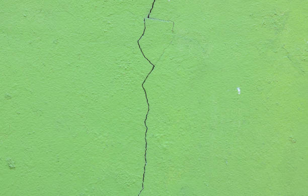 istock Grunge concrete cement wall with crack in industrial 688915842