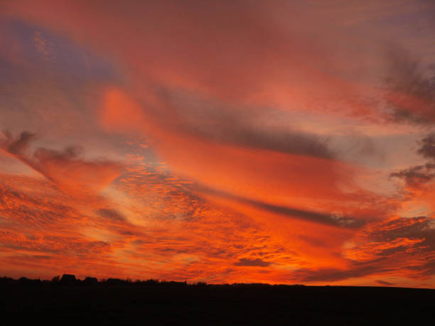 istock Fire in the sky, Sunset over the field 688921272