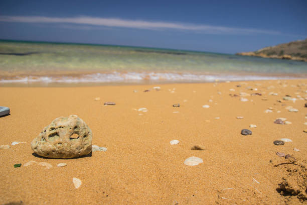 istock Beach yellow sand and rock background 688926026