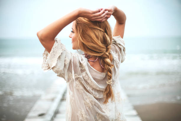 Dreamy girl  on beach Dreamy girl  on beach hairstyle stock pictures, royalty-free photos & images