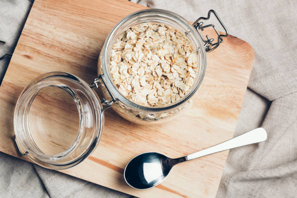 istock Transparent glass jar with rolled oats 688928480