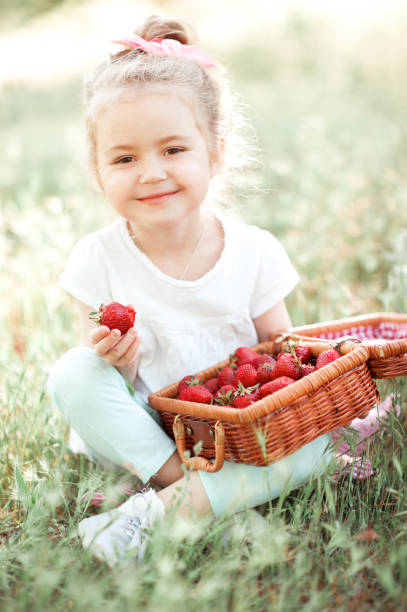 istock Girl with strawberry 688928562