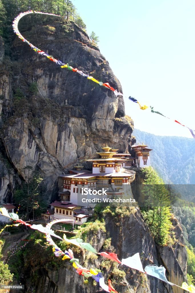 Taktshang Goemba or Tiger's nest monastery with colorful Tibetan prayer flags, Paro, Bhutan. Bhutan Stock Photo