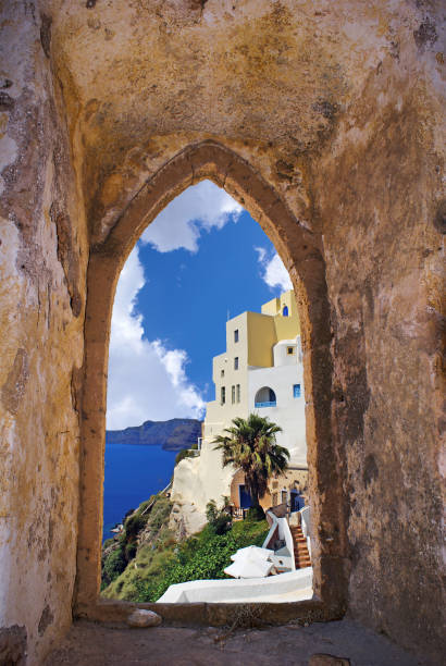 istock Santorini island through an old Venetian window, Greece 688941268