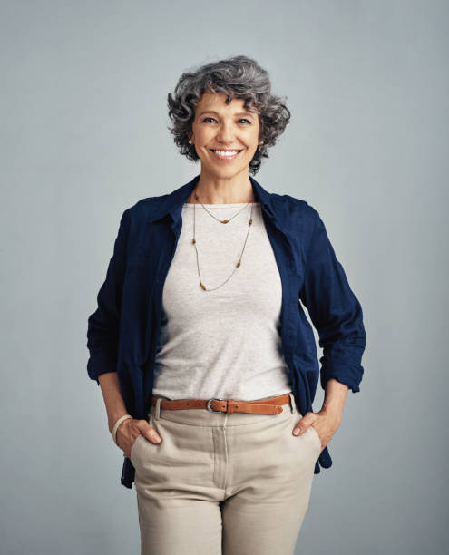 Looking good in the later years Studio portrait of a confident mature woman posing against a gray background middle aged woman fashion stock pictures, royalty-free photos & images