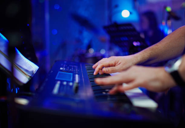 istock Closeup hands of pianist playing 688945268
